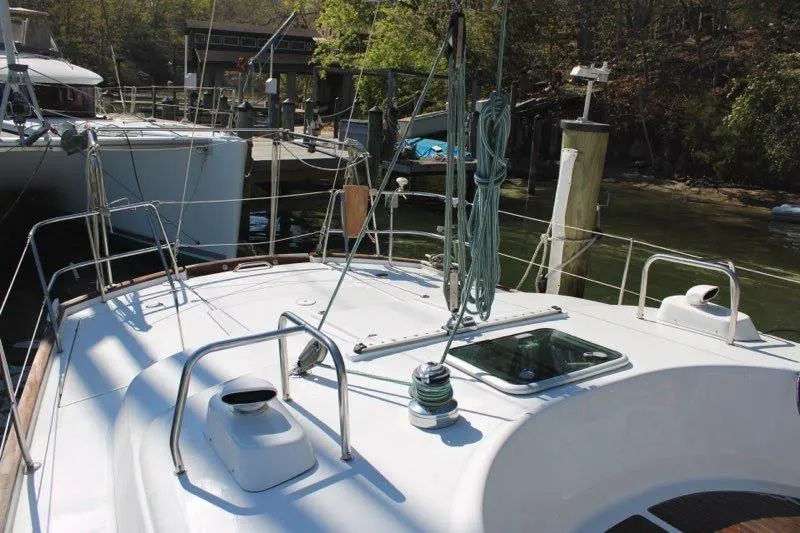 Slide: The Image of 2003 Beneteau Oceanis 42CC sailboat docked, showcasing deck and rigging details. - 69