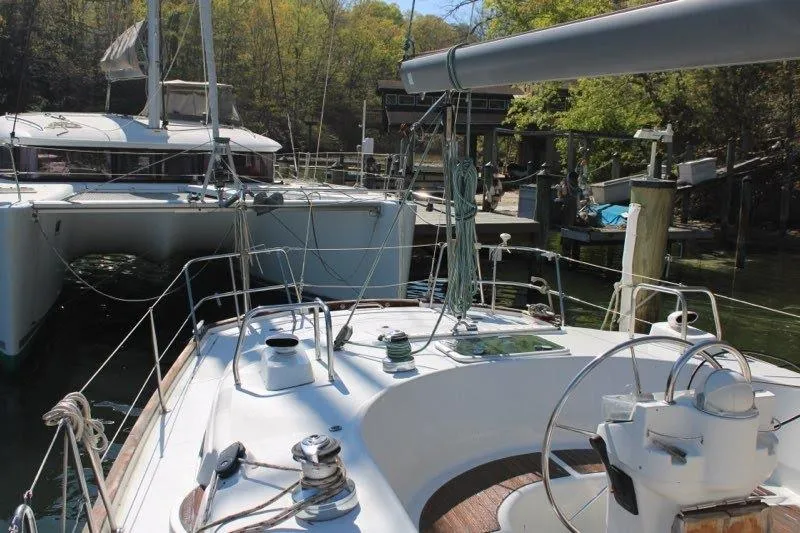 Slide: The Image of 2003 Beneteau Oceanis 42CC sailboat docked, featuring deck and rigging details. - 70