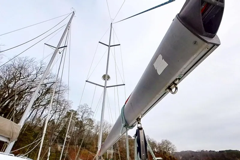 Slide: The Image of Sailboat mast and boom of 2003 Beneteau Oceanis 42CC against a cloudy sky. - 74