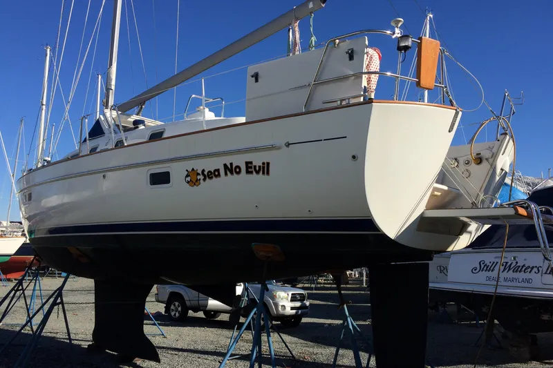 Slide: The Image of 2003 Beneteau Oceanis 42CC sailboat "Sea No Evil" on stands in a boatyard. - 77