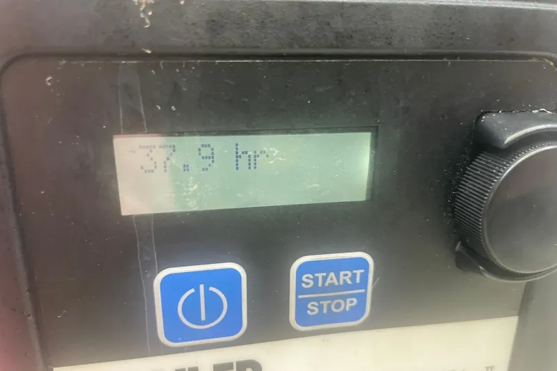 Slide: The Image of Control panel displaying 37.9 hours on a 2014 Cruisers Yachts 380 Express. - 13