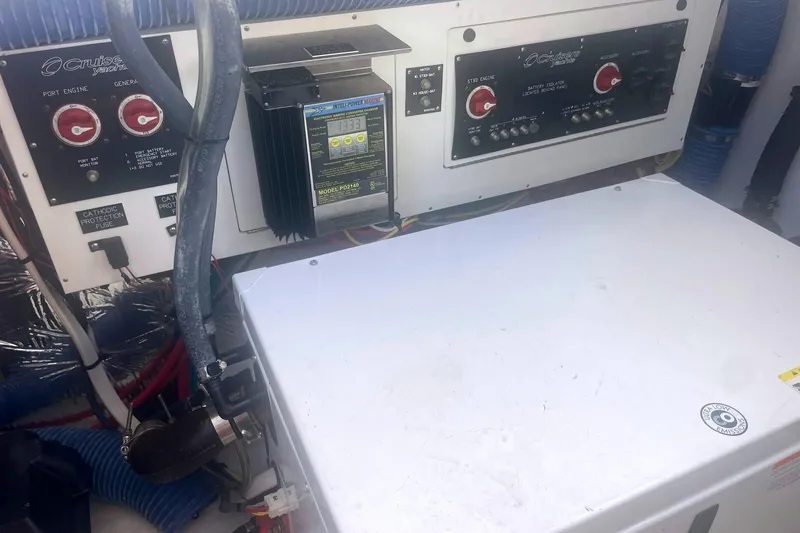 Slide: The Image of Control panel of a 2014 Cruisers Yachts 380 Express, featuring engine and generator controls. - 12