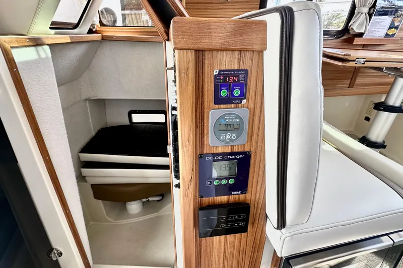 Slide: The Image of 2026 Ranger Tugs R-31 CB interior with control panel and seating. - 10