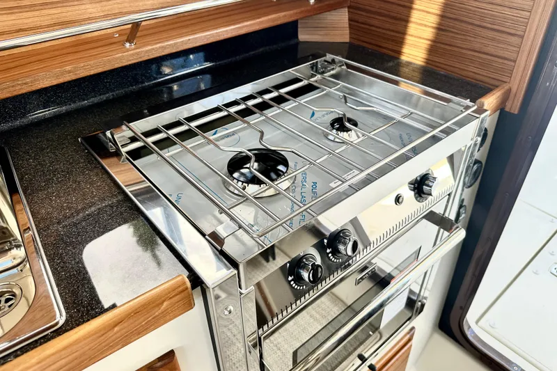 Slide: The Image of Modern kitchen stove in 2026 Ranger Tugs R-31 CB boat interior. - 15