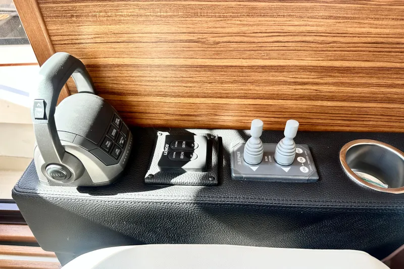 Slide: The Image of Control panel of 2026 Ranger Tugs R-31 CB with joystick and throttle. - 20