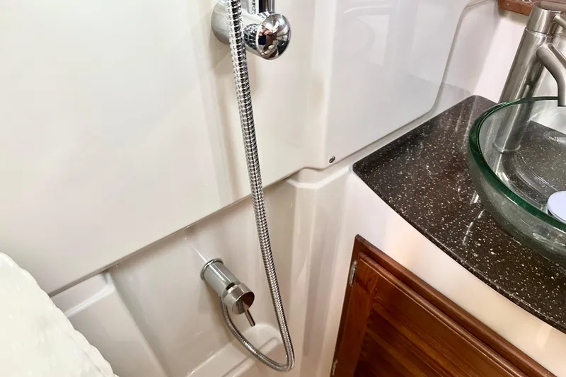 Slide: The Image of Bathroom interior of 2026 Ranger Tugs R-31 CB with modern fixtures. - 34