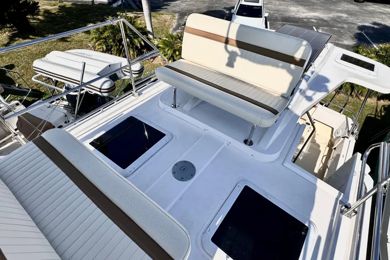 Slide: The Image of 2026 Ranger Tugs R-31 CB boat deck with seating and hatches. - 40