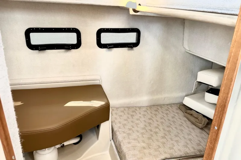 Slide: The Image of Interior cabin of 2026 Ranger Tugs R-31 CB with seating and windows. - 45