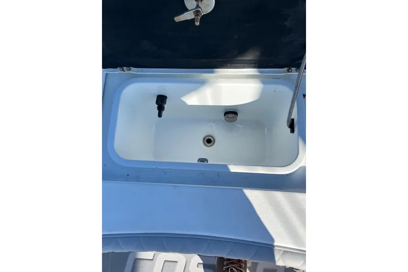 Slide: The Image of Livewell on 2022 Costa Custom Boats 264, featuring a clean, white interior. - 10
