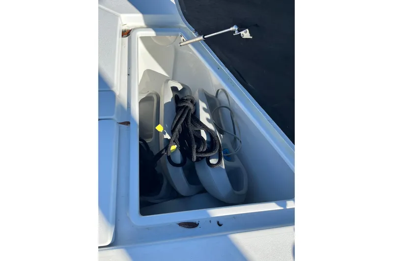 Slide: The Image of Storage compartment of 2022 Costa Custom Boats 264 with ropes and fenders. - 23