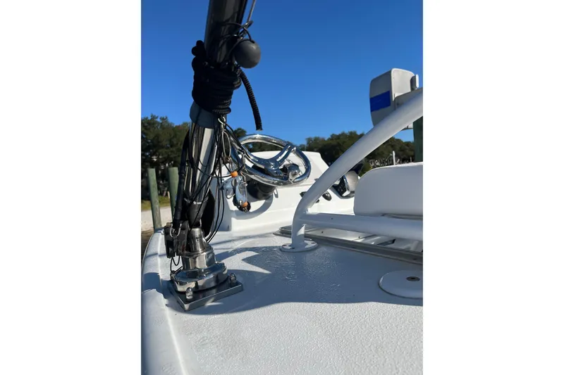 Slide: The Image of 2022 Costa Custom Boats 264 deck with mounted equipment and clear blue sky. - 5