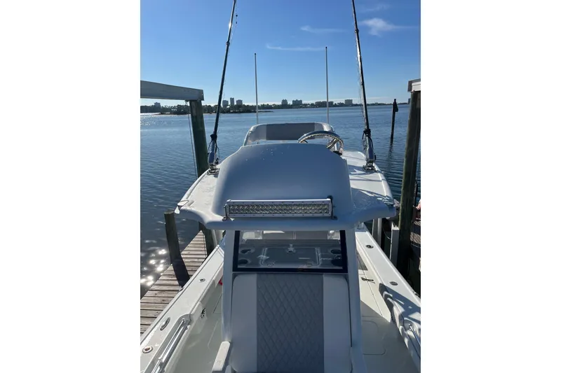 Slide: The Image of 2022 Costa Custom Boats 264 docked, showcasing sleek design and modern features. - 7