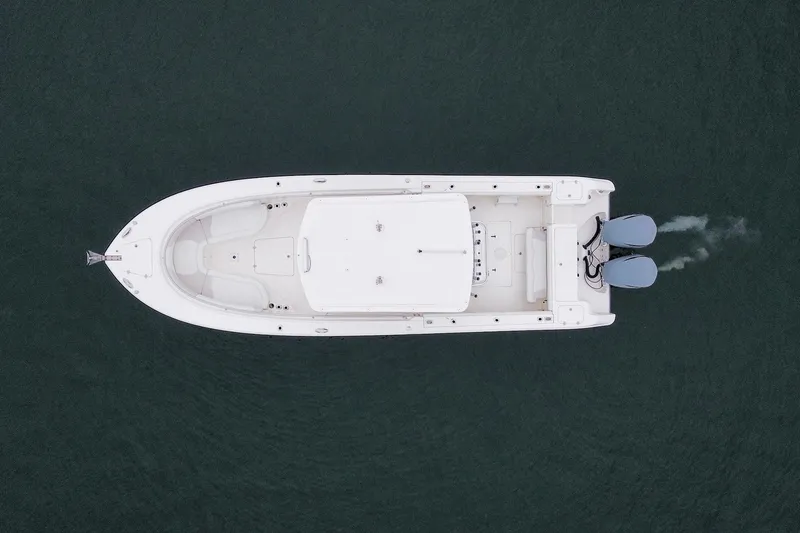Slide: The Image of Aerial view of 2013 Edgewater 318CC boat on calm water. - 10
