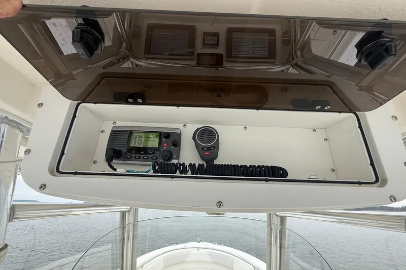 Slide: The Image of 2013 Edgewater 318CC boat console with radio and microphone storage. - 20