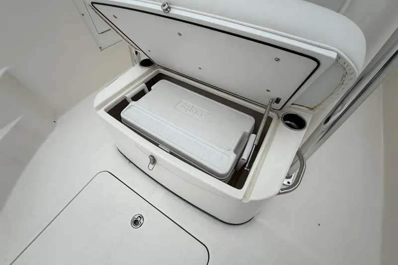 Slide: The Image of 2013 Edgewater 318CC boat with built-in cooler storage compartment. - 29
