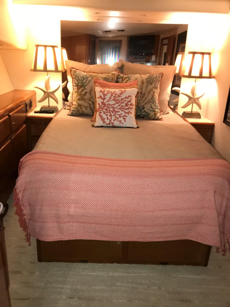 Slide: The Image of Cozy bedroom in 2000 Viking 50 Convertible yacht with coral-themed decor. - 12