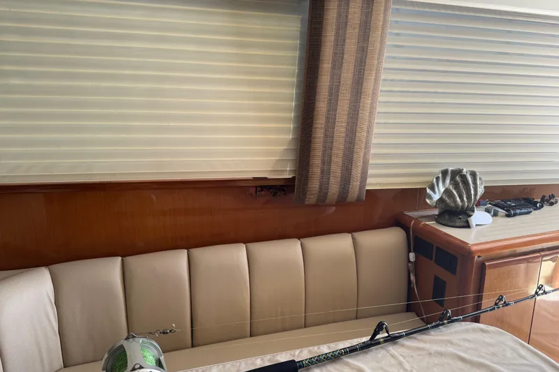 Slide: The Image of Interior of a 2000 Viking 50 Convertible yacht with fishing rod and decorative shell. - 26