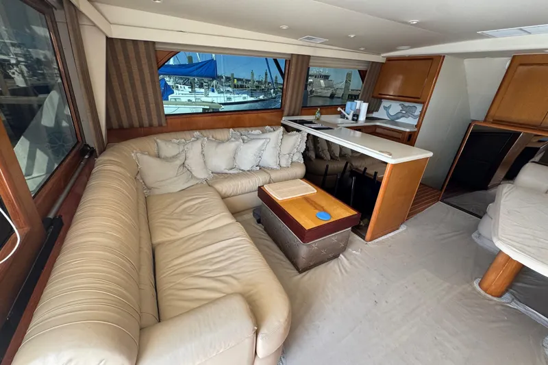 Slide: The Image of Luxurious interior of a 2000 Viking 50 Convertible yacht with plush seating and elegant decor. - 28