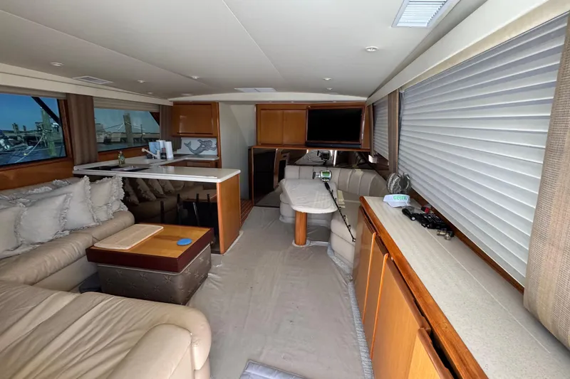Slide: The Image of Luxurious interior of a 2000 Viking 50 Convertible yacht with plush seating and modern amenities. - 29
