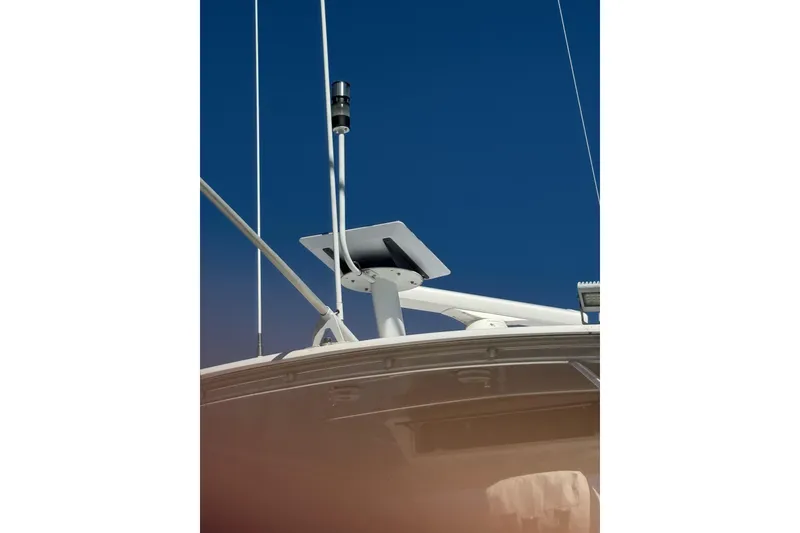 Slide: The Image of Radar equipment on a 2000 Viking 50 Convertible yacht against a clear blue sky. - 35