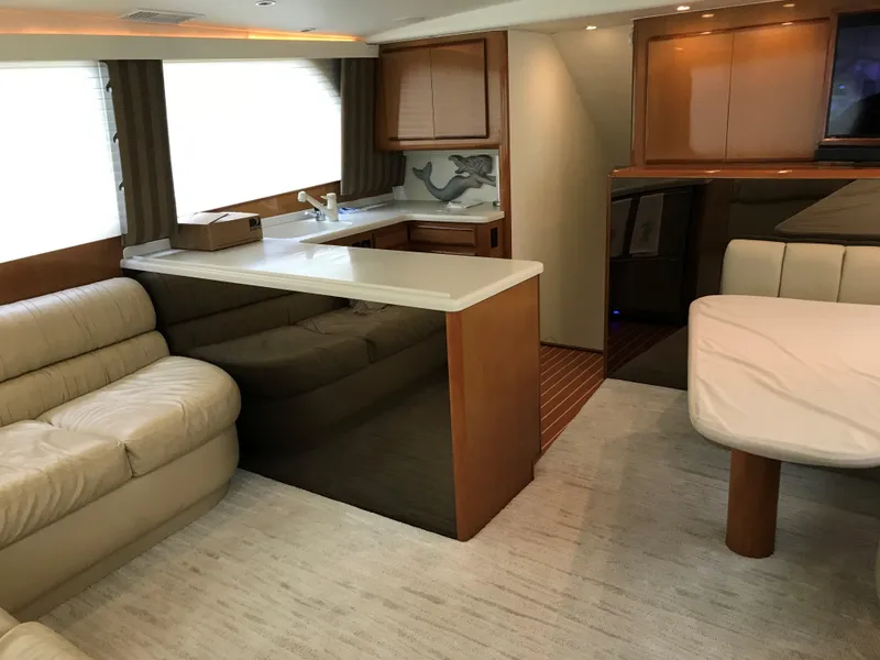 Slide: The Image of Luxurious interior of a 2000 Viking 50 Convertible yacht with modern furnishings. - 9