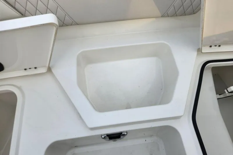 Slide: The Image of 2024 World Cat 260 DC-X boat interior storage compartments. - 10