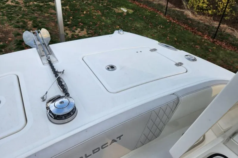 Slide: The Image of 2024 World Cat 260 DC-X boat deck with anchor and storage compartments. - 11