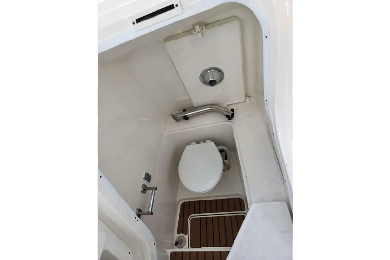 Slide: The Image of 2024 World Cat 260 DC-X boat interior with compact marine toilet. - 18