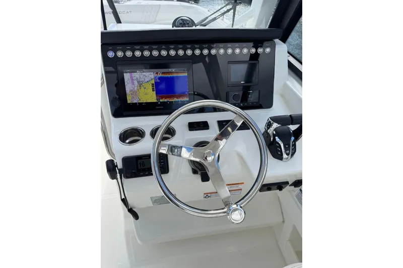 Slide: The Image of 2024 World Cat 260 DC-X helm with steering wheel, navigation display, and controls. - 20