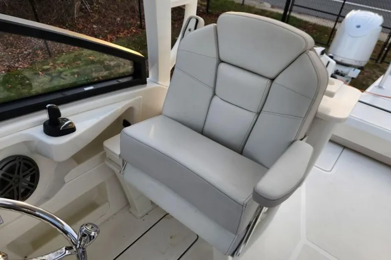 Slide: The Image of Captain's chair in 2024 World Cat 260 DC-X boat cockpit. - 23
