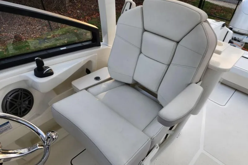 Slide: The Image of Captain's chair in 2024 World Cat 260 DC-X boat cockpit. - 24
