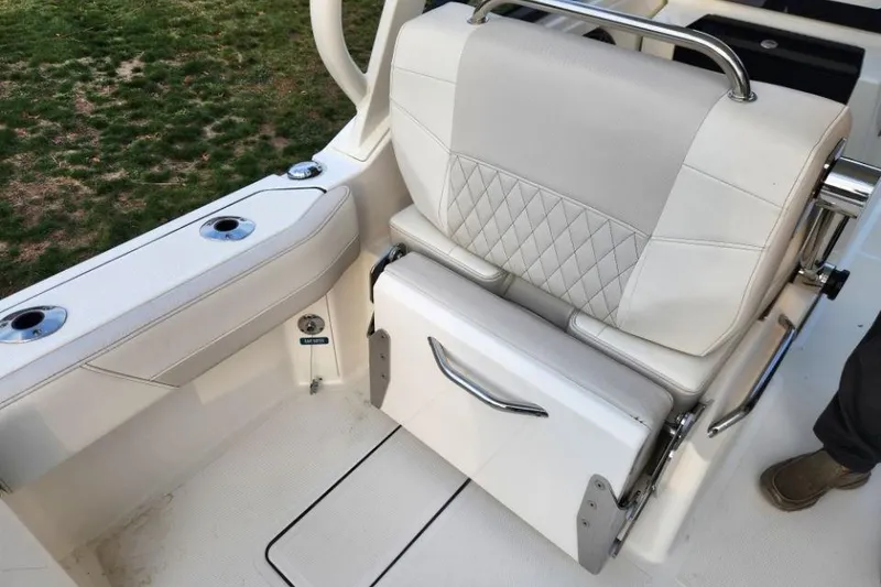 Slide: The Image of 2024 World Cat 260 DC-X boat seat with diamond stitching and stainless steel handle. - 27