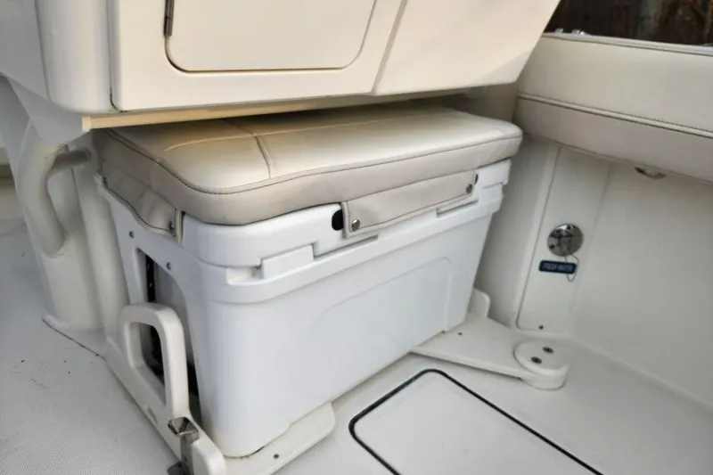 Slide: The Image of 2024 World Cat 260 DC-X boat interior with cushioned storage seat. - 28
