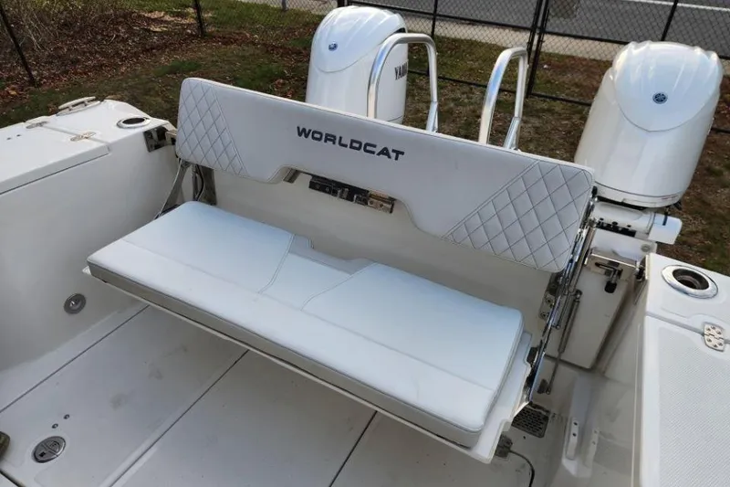 Slide: The Image of 2024 World Cat 260 DC-X boat with white seating and dual engines. - 33