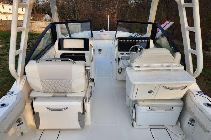 Slide: The Image of 2024 World Cat 260 DC-X boat interior with dual consoles and seating. - 34