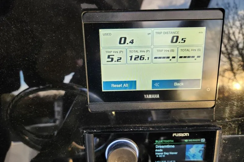 Slide: The Image of Yamaha display on 2024 World Cat 260 DC-X showing trip data and Bluetooth settings. - 36