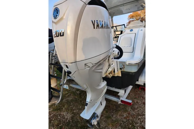 Slide: The Image of 2024 World Cat 260 DC-X with Yamaha outboard engine on trailer. - 38