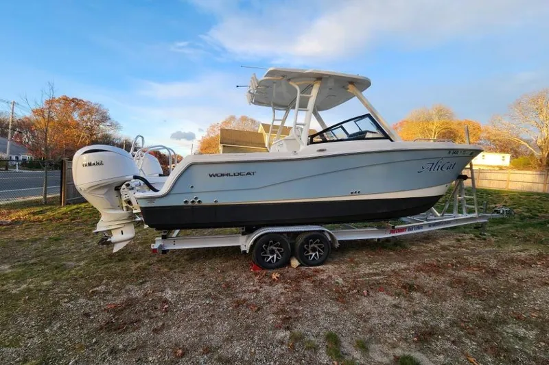 Slide: The Image of 2024 World Cat 260 DC-X boat on trailer, parked outdoors. - 4