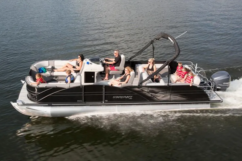 Slide: The Image of 2016 Starcraft MX 25 DL pontoon boat with outboard motor under bright sun. - 1