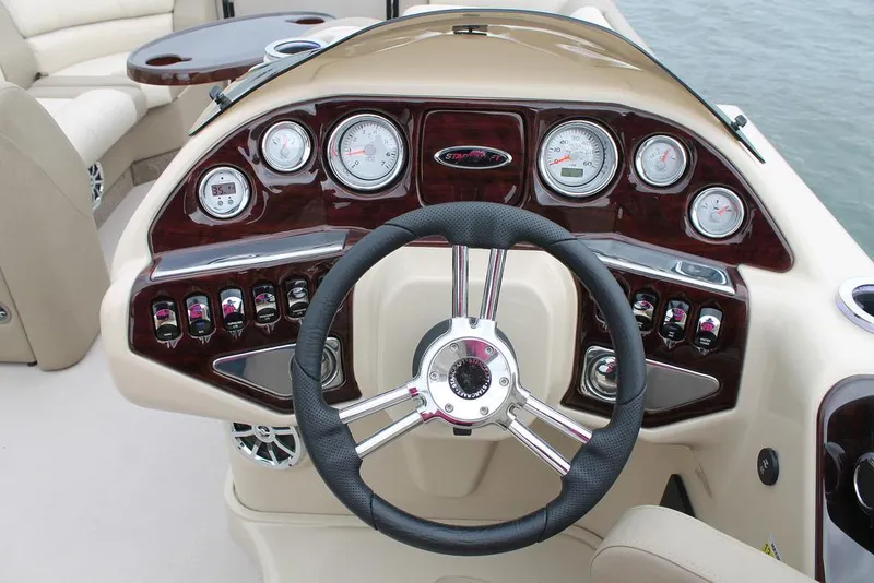 Slide: The Image of Luxurious 2016 Starcraft MX 25 DL boat interior with plush seating and wooden flooring. - 6