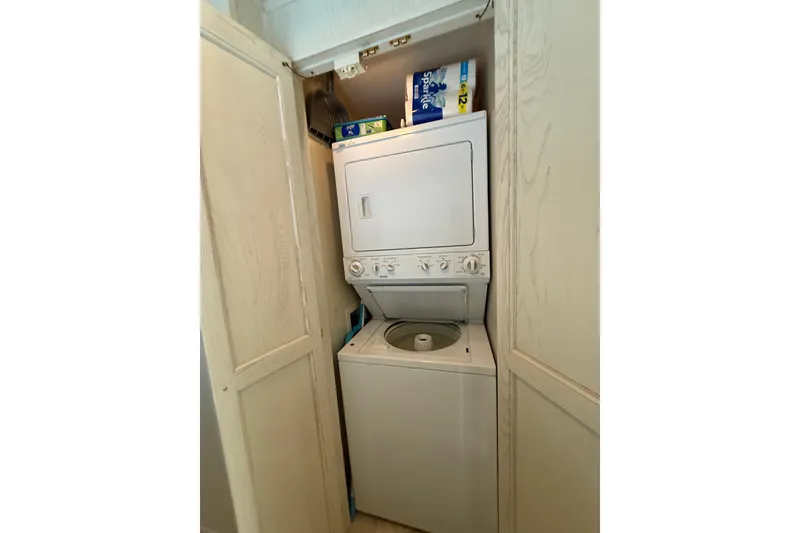 Slide: The Image of Stacked washer and dryer in 2000 Stardust Cruisers houseboat laundry area. - 12