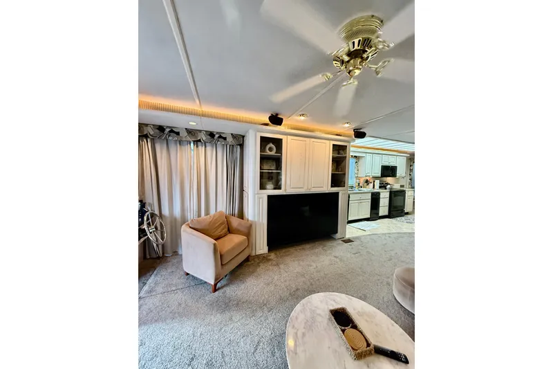 Slide: The Image of Luxurious 2000 Stardust Cruisers houseboat interior with modern kitchen and cozy living area. - 4