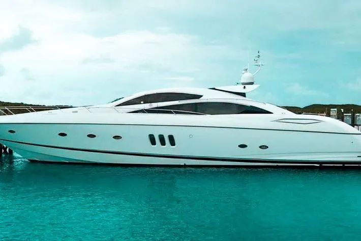 The Image of 2006 Sunseeker Predator 82 yacht on turquoise water, showcasing sleek design and luxury. - 1