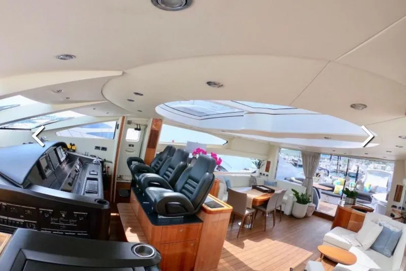 Slide: The Image of Luxurious interior of 2006 Sunseeker Predator 82 yacht with modern seating and elegant decor. - 13