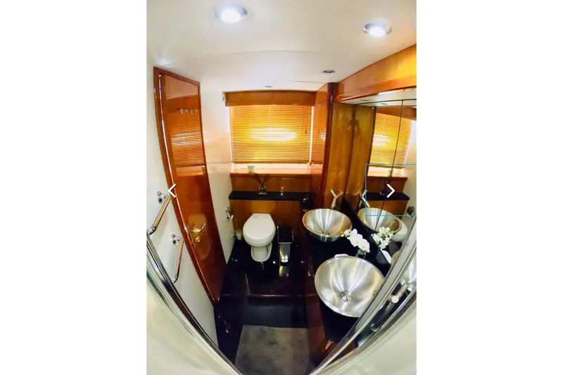 Slide: The Image of Luxurious bathroom in 2006 Sunseeker Predator 82 yacht with modern fixtures and wooden accents. - 18
