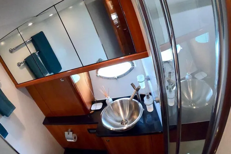 Slide: The Image of Luxurious bathroom in 2006 Sunseeker Predator 82 yacht with modern fixtures and elegant design. - 22