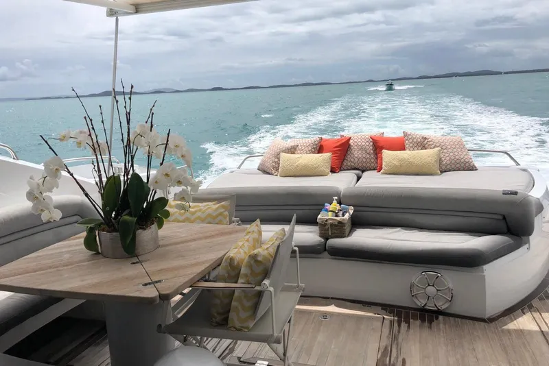 Slide: The Image of Luxurious Sunseeker Predator 82 yacht deck with elegant seating and ocean view, 2006 model. - 9