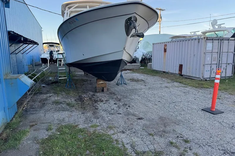Slide: The Image of 2022 Grady-White Freedom 335 boat on stands in a storage yard. - 24