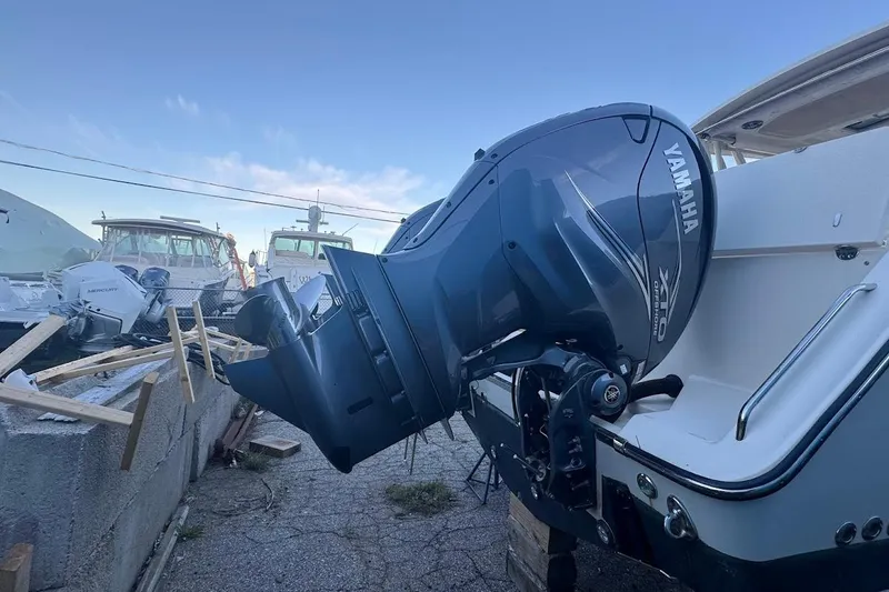 Slide: The Image of 2022 Grady-White Freedom 335 with Yamaha outboard motor in a boatyard. - 6