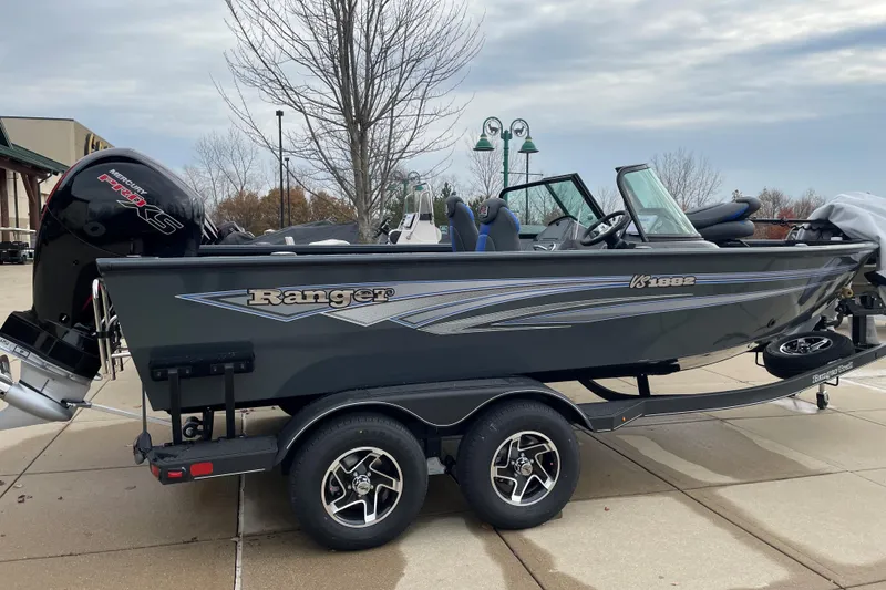 The Image of 2026 Ranger VS1882SC Angler boat on trailer, parked outdoors. - 0